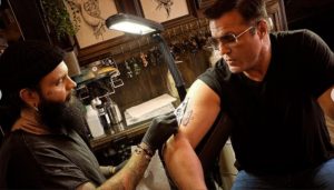 Chael Sonnen getting a tattoo