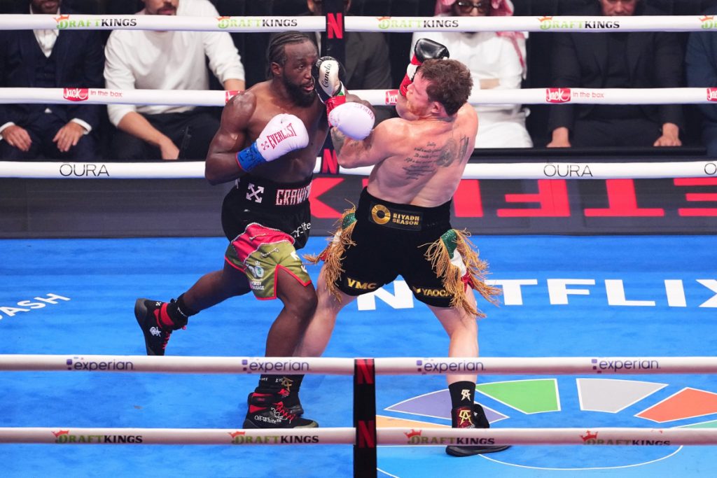 Canelo Alvarez gets hit with a punch by Terence Crawford