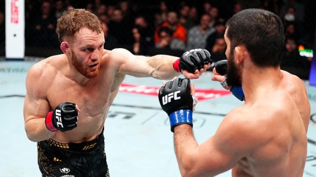 Jack Della Maddalena throws a punch at Islam Makhachev during UFC 322 main event