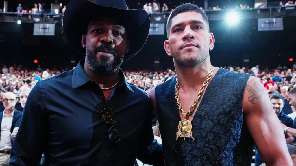 Alex Pereira and Jon Jones pose for a photograph at UFC 306.
