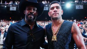 Alex Pereira and Jon Jones pose for a photograph at UFC 306.
