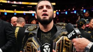 Islam Makhachev with two UFC belts