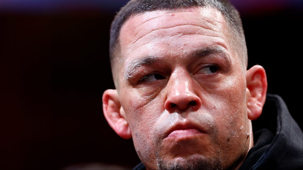 Nate Diaz enters the boxing ring for his fight against Jorge Masvidal