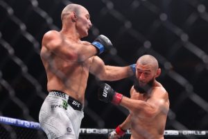 Sean Strickland lands a punch on Khamzat Chimaev at UFC 328