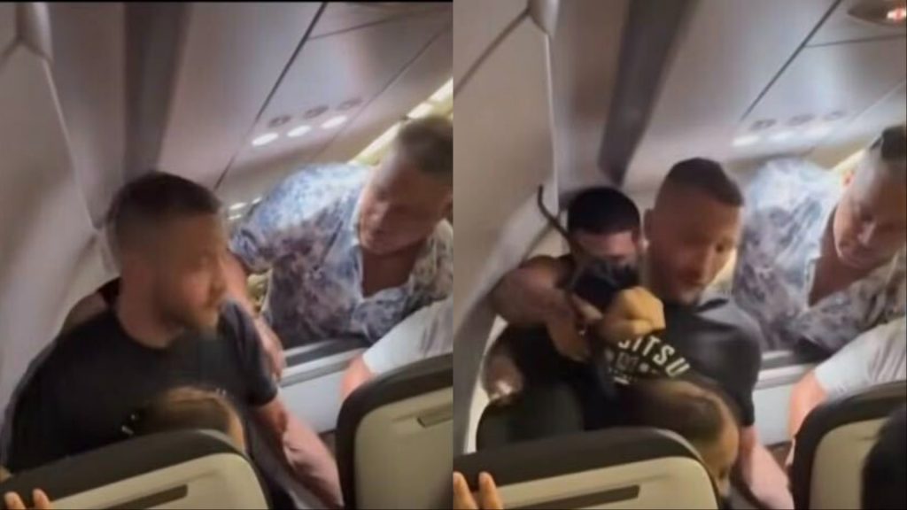 Josh Longood restrains an unruly passenger