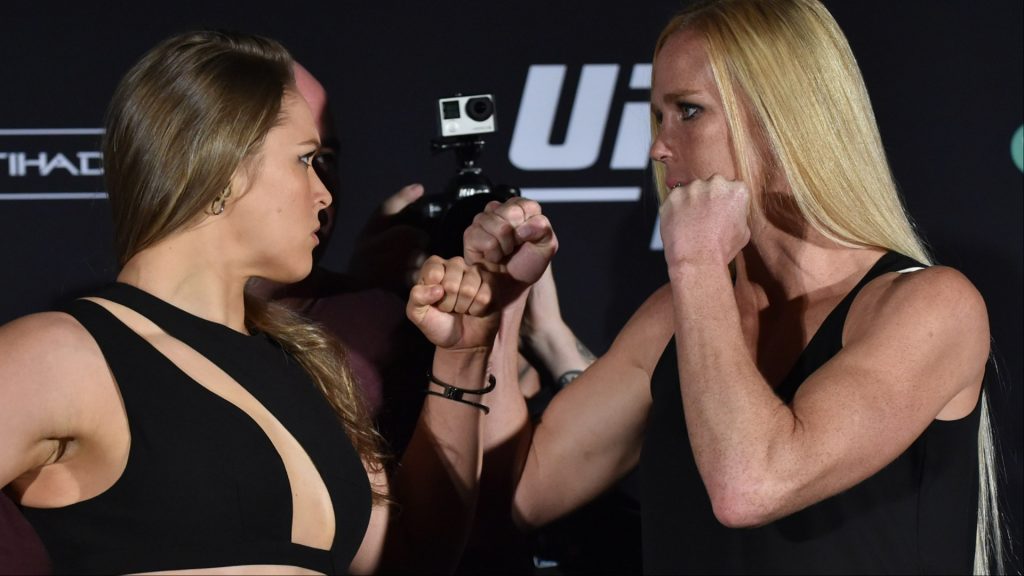 Ronda Rousey and Holly Holm face off at a press conference