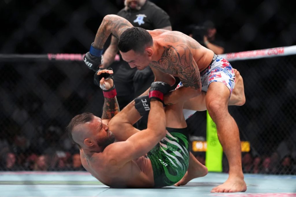 Conor McGregor defeated by Max Holloway after suffering right leg injury at UFC 329
