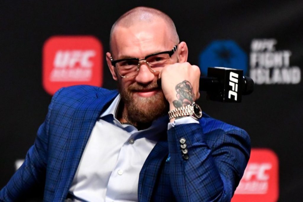 Conor McGregor speaks to media members during a UFC 257 press event