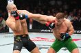 Dricus du Plessis lands a punch on Sean Strickland during UFC 297
