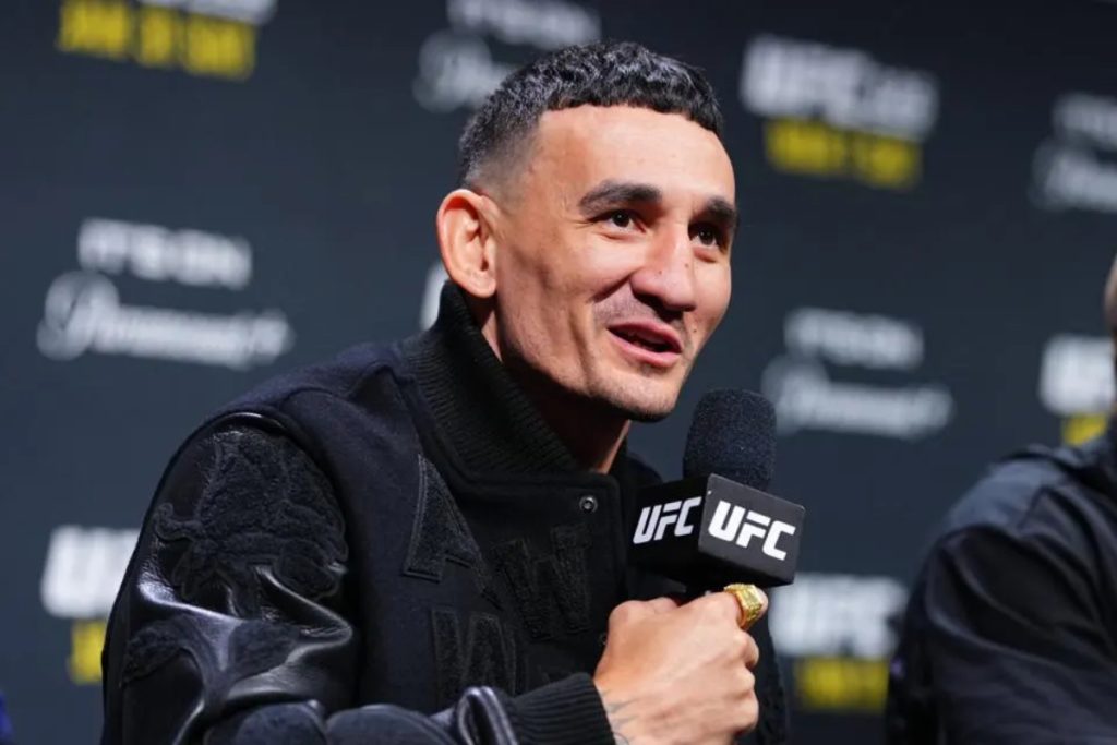 Max Holloway speaks to reporters during a UFC 326 press conference