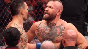 Conor McGregor speaks with Max Holloway after UFC 329