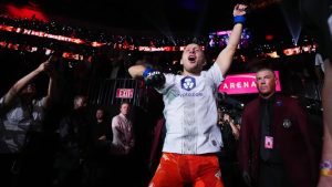Paddy Pimblett dances during his UFC 329 walkout prior to choking out Benoit Saint Denis