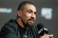 Robert Whittaker answers questions from media members before a UFC event